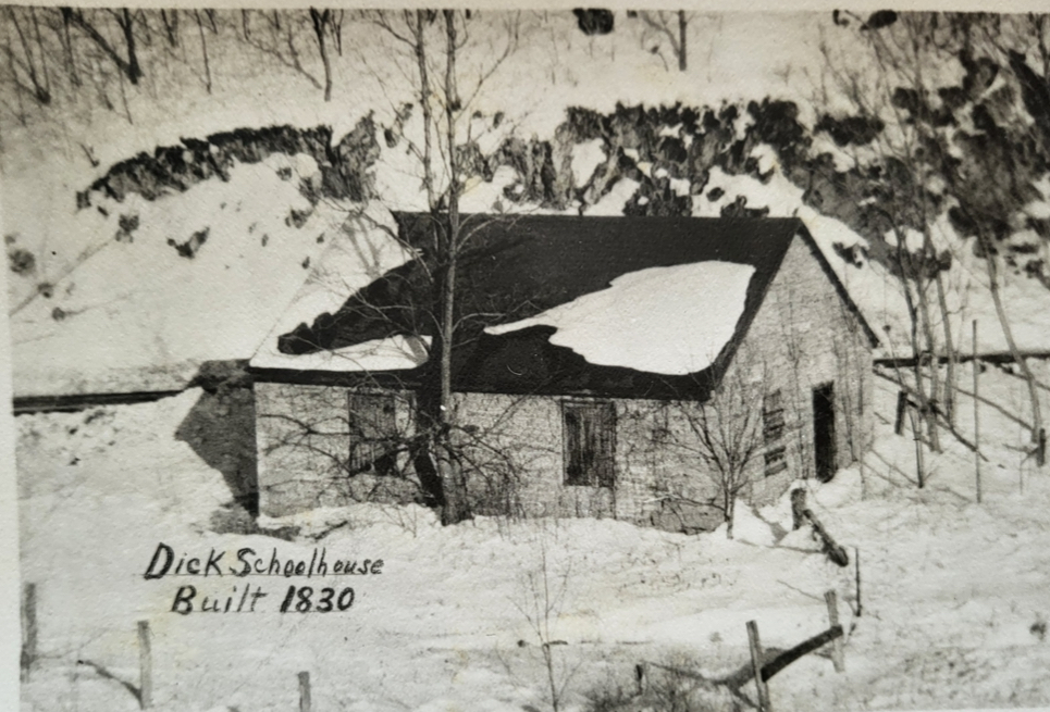 Black and White photograph of Dick School House in its state in winter in the 1960s.
